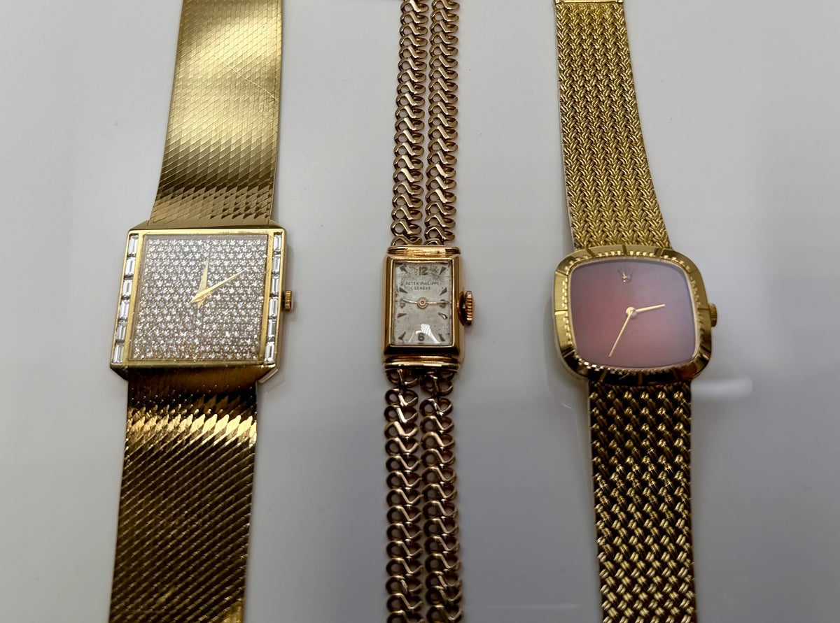 Explore vintage wristwatches: three gold-tone bracelet watches with rectangular and rounded cases.